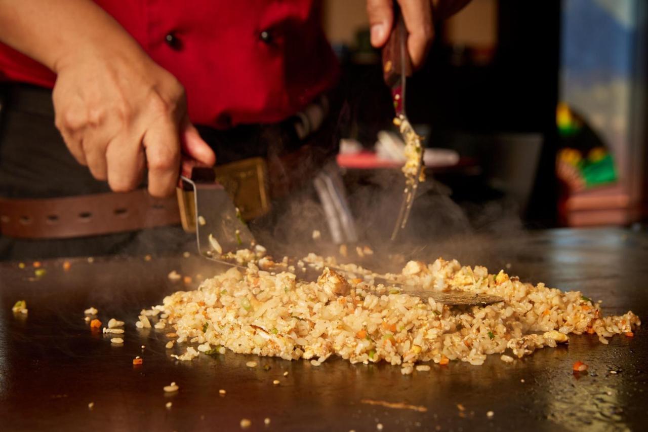Sheraton Bucharest Hotel Exterior photo Fried rice being cooked on a flattop
